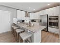 Beautiful kitchen with stainless steel appliances, granite counters, and a breakfast bar with seating at 109 Ailey Brook Way # 100, Wake Forest, NC 27587