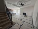 Spacious living area showcases the staircase, fireplace, and open layout to the kitchen and dining area at 141 Trescott St, Smithfield, NC 27577