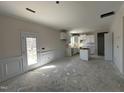 White kitchen with island and access to backyard at 15 Lupin Dr, Smithfield, NC 27577