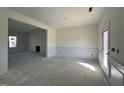 Formal dining room with wainscoting and access to the living room at 253 Trescott St, Smithfield, NC 27577