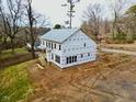 Aerial view of the house's rear, highlighting its two-story design and exterior features at 301 W College St, Louisburg, NC 27549