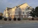 Exterior view of a light beige apartment building at 3015 Winston Dr # Apt 102, Burlington, NC 27215