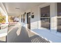 Bright and spacious front porch with white columns and railing at 507 Price Ave, Durham, NC 27701