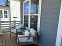 Cozy porch featuring cushioned chairs, providing a relaxing outdoor space to enjoy the view from the home at 54 Cottage Way Way, Pittsboro, NC 27312