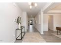 Inviting foyer with stylish decor and light gray hardwood flooring at 62 Faircox Way # 139, Garner, NC 27529