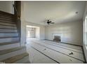 Spacious living room with fireplace and stairs leading upstairs at 65 Barony Ln, Smithfield, NC 27577