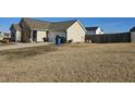 Large backyard with a wooden fence at 670 Meadowtop Cir, Burlington, NC 27217