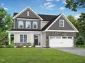 Charming two-story home with stone accents, a covered porch, and a well-manicured lawn at 71 Priming Way, Angier, NC 27501