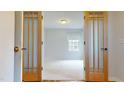 Bright bedroom with carpeted floors and a window at 7607 Divot Dr, Sanford, NC 27332