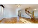 Spacious living room with hardwood floors and lots of natural light at 7607 Divot Dr, Sanford, NC 27332