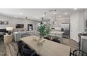 Open concept dining area with kitchen views and a spacious wooden table at 1110 Freestone Rd, Durham, NC 27703