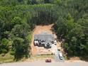 New construction modern farmhouse with covered porch nestled on a wooded lot at 1236 Perry Bluff Dr, Wake Forest, NC 27587