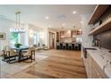 Open concept dining room with hardwood floors and modern chandelier at 2011 Angier Ave, Durham, NC 27703