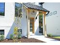Stylish front entrance with modern wood and metal accents at 2011 Angier Ave, Durham, NC 27703