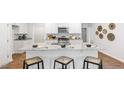 Modern kitchen island with granite countertops and seating at 2180 Monk Dr, Haw River, NC 27258