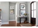 Elegant foyer with hardwood floors, stylish console table, and tasteful decor, creating a welcoming entrance at 2721 Sanctuary Woods Ln, Raleigh, NC 27606