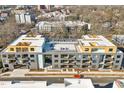 Modern apartment complex with rooftop deck and seating, providing a luxurious urban living experience at 29 Enterprise St # 309, Raleigh, NC 27607