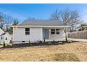 Newly renovated house with gray siding, landscaping, and a covered porch at 2917 State St, Durham, NC 27704