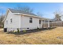 Side view of newly renovated house with gray siding and landscaping at 2917 State St, Durham, NC 27704