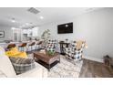 Stylish living room with comfortable seating, decorative rug and entertainment center at 315 E Fourth St, Wendell, NC 27591