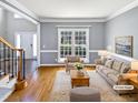 Spacious living room featuring hardwood floors and a neutral color palette at 408 Froyle Ct, Rolesville, NC 27571