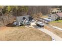 Aerial view showing a house nestled in a wooded neighborhood at 46 Trusting Ln, Middlesex, NC 27557
