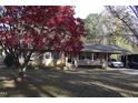 House with red leaf tree in front yard at 628 Stratford Dr, Zebulon, NC 27597