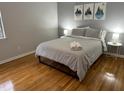 Spacious bedroom with hardwood floors and a queen bed at 1002 Willow Dr # 56, Chapel Hill, NC 27514