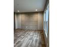 Living room featuring wood-look flooring and an accent wall at 1039 Branch Chapel Church Rd, Selma, NC 27576