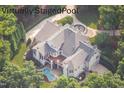 Bird's-eye view of house, pool, and landscaping at 11201 Jonas Ridge Ln, Raleigh, NC 27613