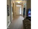 Bright entryway with hardwood floors and view to the living room at 166 Easy Wind Ln, Garner, NC 27529