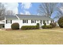 Front view of a Ranch home with a spacious yard at 1805 Brown Ave, Burlington, NC 27215