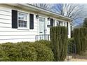 Front entrance with white door and black shutters at 1805 Brown Ave, Burlington, NC 27215