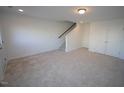 Spacious unfinished basement with carpeted floors and ample storage at 1924 Robin Hill Ln, Raleigh, NC 27610