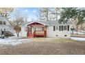 Brick ranch home with covered porch and landscaped yard at 402 Sparella St, Durham, NC 27703