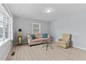 Bright living room with light flooring and comfy seating at 402 Sparella St, Durham, NC 27703