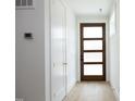 Bright entryway with light hardwood floors and white walls at 508 Lakeland St # A, Durham, NC 27701