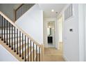 Modern staircase with light wood and black metal railing at 508 Lakeland St # A, Durham, NC 27701