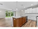 Spacious kitchen with white cabinets, quartz countertops, and island at 609 Marshskip Way, Rolesville, NC 27571