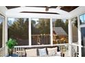 Relaxing screened porch overlooking the backyard with a playset at 7713 Stonehenge Farm Ln, Raleigh, NC 27613