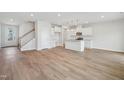 Open-concept living space with a stylish kitchen, hardwood floors, and ample natural light at 911 Montague Ave, Durham, NC 27703