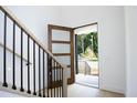 Open entryway with wooden staircase and view of front porch at 916 Ardmore Dr, Durham, NC 27713
