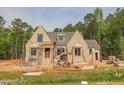 An attractive one-story brick house is under construction with scaffolding at 1117 Delilia Ln, Wake Forest, NC 27587