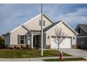 Beige house with white garage door and landscaping at 1254 Linkwood, Homesite 48, Fuquay Varina, NC 27526