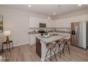 Modern kitchen with granite countertops and stainless steel appliances at 152 Rolesville Ridge Dr, Rolesville, NC 27571