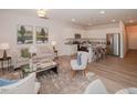 Open living room and kitchen with modern appliances and light flooring at 152 Rolesville Ridge Dr, Rolesville, NC 27571