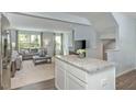Kitchen with island overlooking living room at 256 Grand Silo Rd, Garner, NC 27603