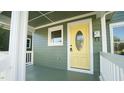 Inviting front porch with a bright yellow door at 300 Worth St, Raleigh, NC 27601