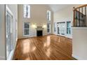 Large living room featuring hardwood floors and fireplace at 5621 Voorhees Ln, Holly Springs, NC 27540