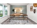 Bright home office features a large window and built-in desk at 6012 Sodium St, Raleigh, NC 27610